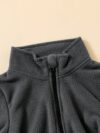 Newness Cozy Comfort Boys Winter Fleece Set A stylish and cozy two piece fleece set for boys perfect for keeping warm during winter The image shows a boy wearing the set showcasing its soft fleece fabric and trendy design