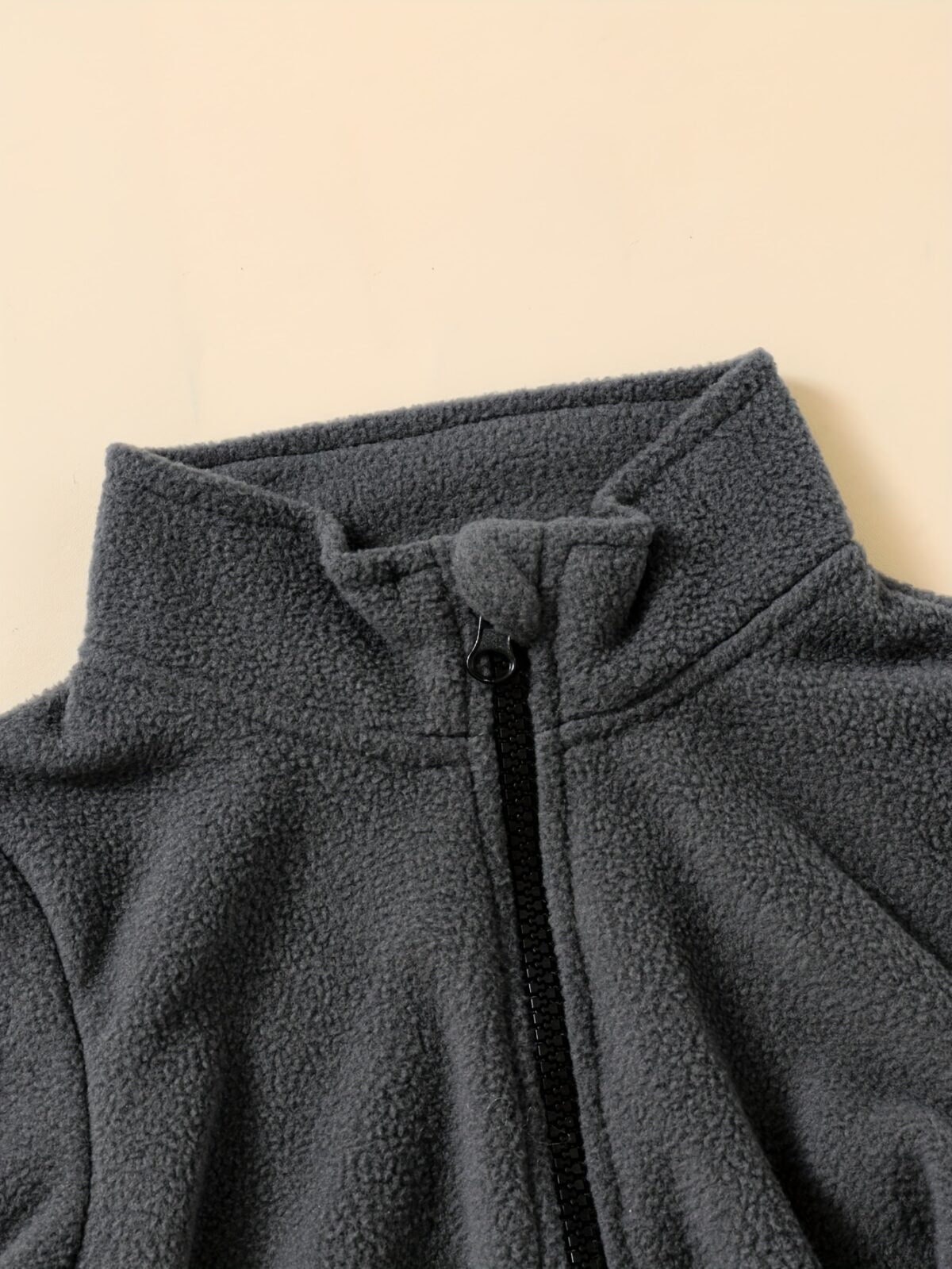 Newness Cozy Comfort Boys Winter Fleece Set A stylish and cozy two piece fleece set for boys perfect for keeping warm during winter The image shows a boy wearing the set showcasing its soft fleece fabric and trendy design