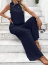 The Newness Riviera Navy Two Piece Set A stylish and comfortable navy blue two piece outfit perfect for spring and summer The image shows a model wearing the complete set