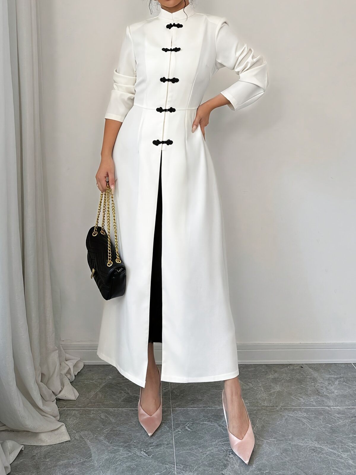 Flattering Timeless Chic Womens Stand Collar Tunic in versatile 100 polyester Featuring a chic stand collar and contrast button details this tunic offers elegance and comfort for all seasons