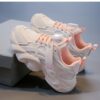 Pastel Petal Girls Sneakers with Rotating Buckle Closure   Trendy pastel pink and white sneakers with a unique rotating buckle perfect for school playdates and sports Breathable comfort and durable rubber sole