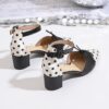 Chic Parisian Polka Dot Mary Janes from Newness A stylish pair of black and white polka dot Mary Jane shoes perfect for summer