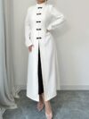 Flattering Timeless Chic Womens Stand Collar Tunic in versatile 100 polyester Featuring a chic stand collar and contrast button details this tunic offers elegance and comfort for all seasons