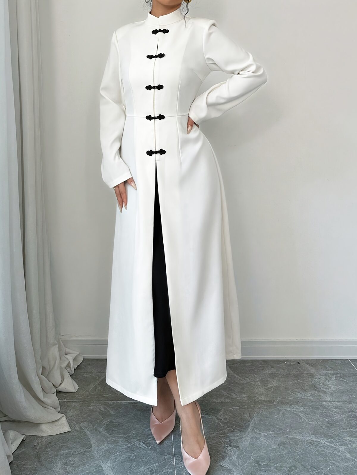 Flattering Timeless Chic Womens Stand Collar Tunic in versatile 100 polyester Featuring a chic stand collar and contrast button details this tunic offers elegance and comfort for all seasons