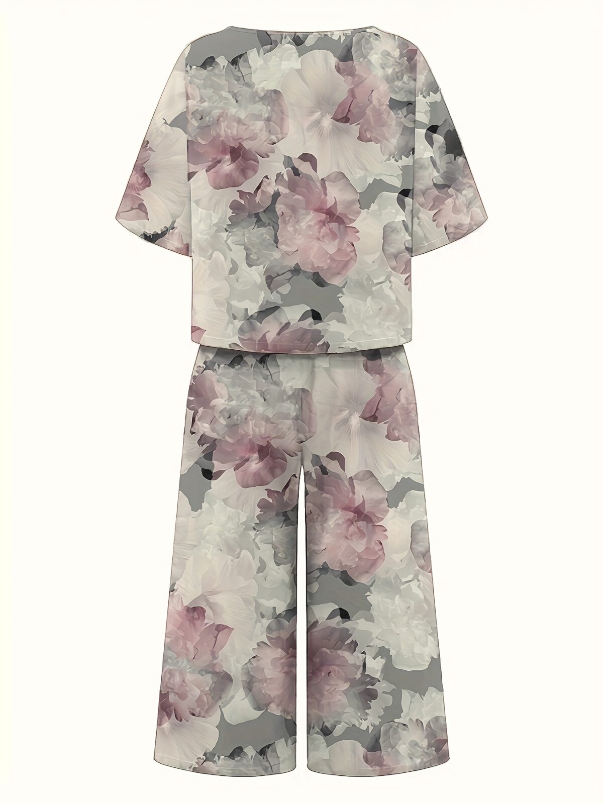 Effortless style meets ultimate comfort in the Newness Casablanca Floral Print Set This stunning 100 polyester two piece set features a vibrant floral print perfect for any occasion