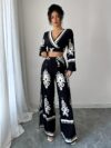 Effortlessly chic Casablanca Ethnic Print Set from Newness featuring a backless top and wide leg pants Model showcases the two piece outfit