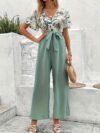 Escape to Paradise Floral Vacation Outfit A chic and comfortable floral outfit perfect for spring getaways Model shown wearing the complete outfit including mention specific items like dress shorts top etc showcasing its breezy and stylish design