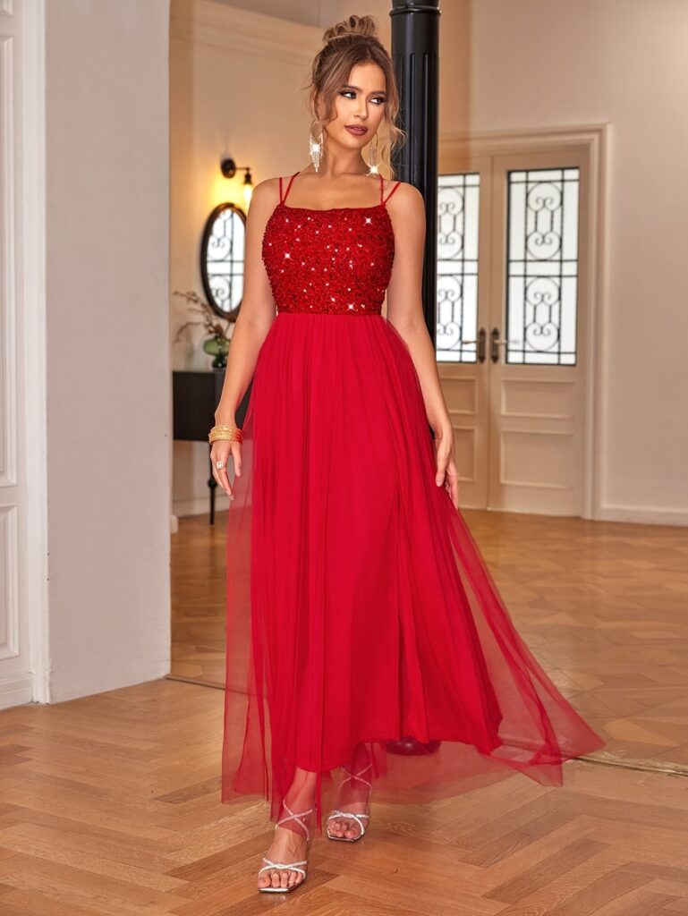 Dazzle in our Evening Sparkle Pink Sequin Evening Gown. This stunning off-the-shoulder gown features shimmering sequins and elegant tulle, perfect for your next formal event.