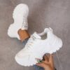 White womens chunky sneakers with geometric embroidery thick sole and lace up closure