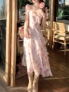 Model wearing a stunning Newness Summer Solstice Floral Print Maxi Dress showcasing its lightweight chiffon fabric asymmetrical hemline and beautiful floral print The dress flows gracefully