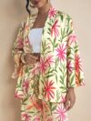 Model wearing the Newness Summer Escape Tropical Print Suit a vibrant and chic outfit perfect for beach vacations and beyond