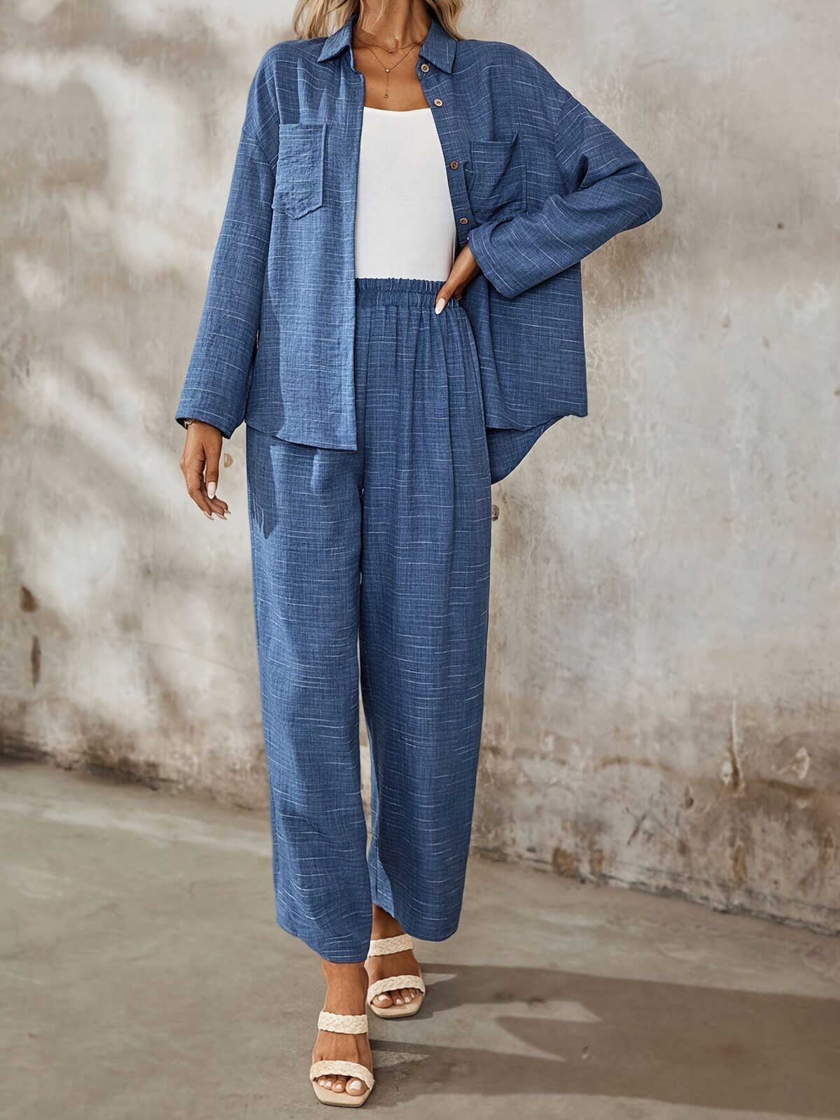 The Newness Dubai Chic Two Piece Pant Set in a flattering modern design perfect for spring or fall A stylish woman confidently wears the matching pants and top