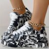 Newness Street Chic Graffiti Print Sneakers Elevate your street style with these chic comfortable and durable sneakers featuring a bold graffiti print