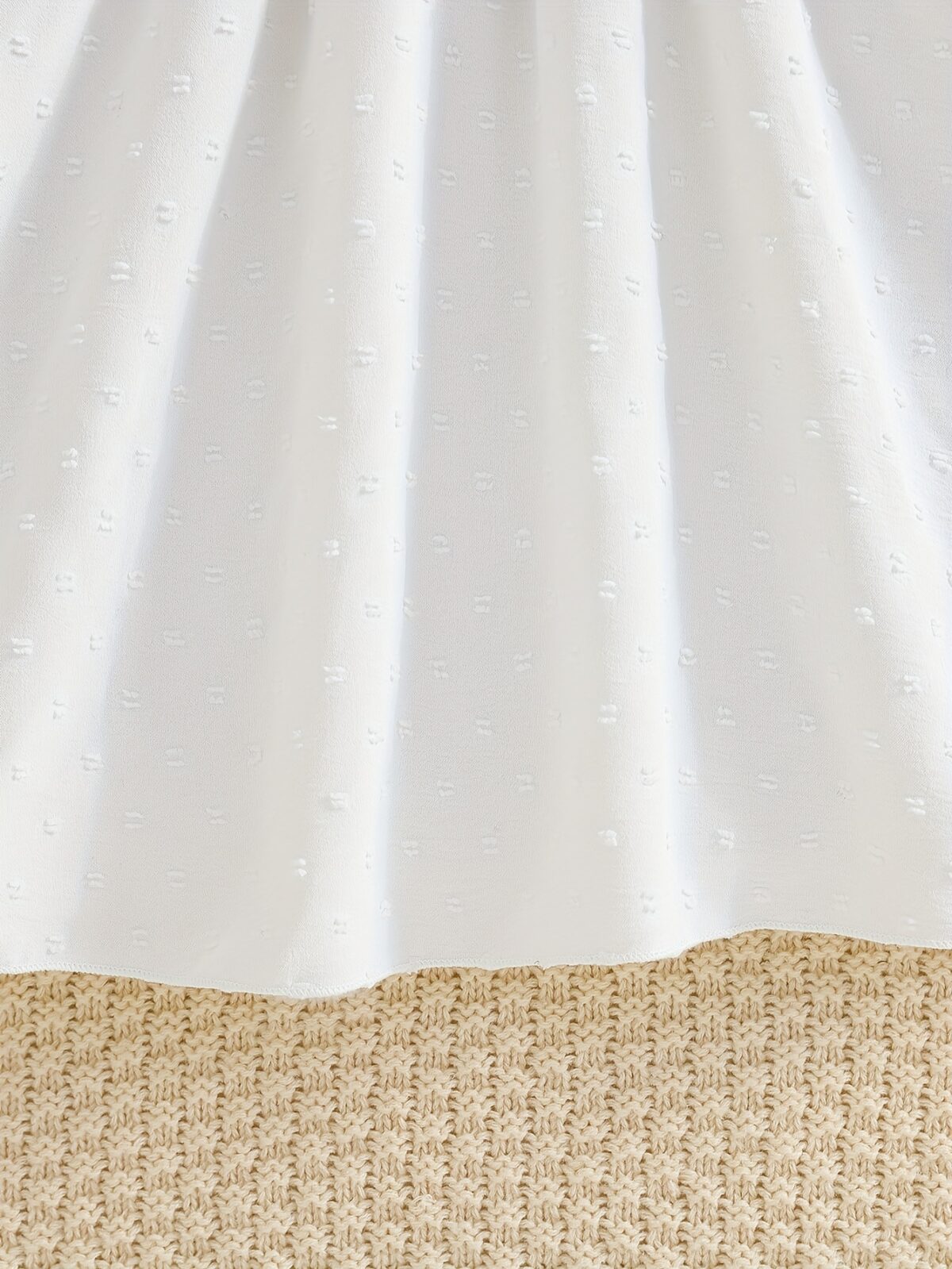 Newness Kensington Jacquard Floral Dress A chic and elegant floral dress perfect for spring Close up view showing the intricate jacquard fabric and flattering silhouette