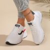 Newness City Chic White Accent Sneakers Modern white sneakers with stylish accents perfect for any occasion