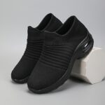 Womens black slip on sneakers with breathable knit upper comfortable wedge heel and cushioned sole