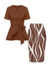 The Newness Cairo Tie Bow Two Piece Set A sophisticated modern two piece outfit featuring a stylish tie bow detail perfect for any occasion