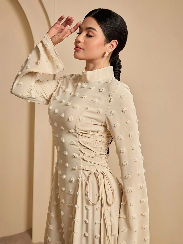 Model wearing a Sahara Sands Beige Textured Maxi Dress, showcasing its elegant and sophisticated style. The dress is a flowing maxi length with a textured fabric.