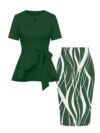 The Newness Cairo Tie Bow Two Piece Set A sophisticated modern two piece outfit featuring a stylish tie bow detail perfect for any occasion