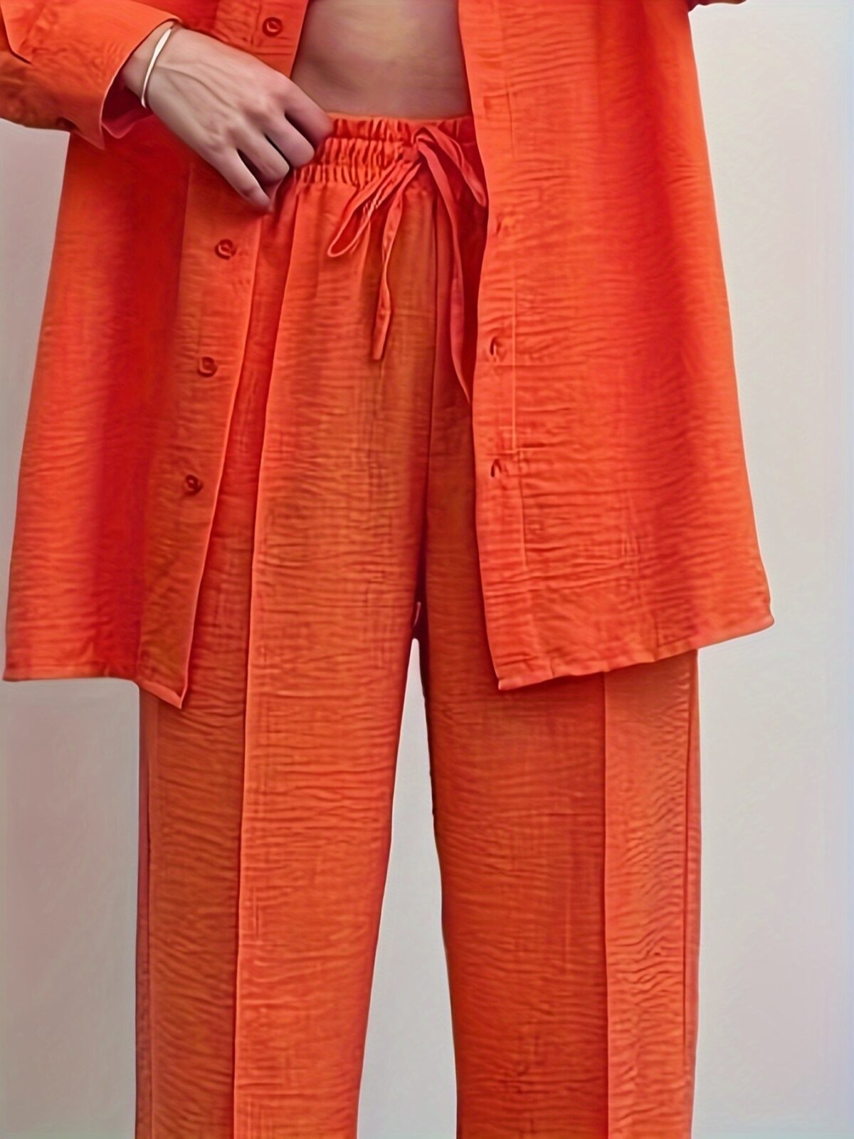 Model wearing a vibrant wide leg pants set perfect for spring The set features a flowy comfortable fit in a breathable polyester fabric