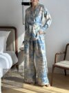 Effortlessly chic Riviera Romance floral print two piece set featuring a long sleeve shirt and wide leg pants perfect for all seasons