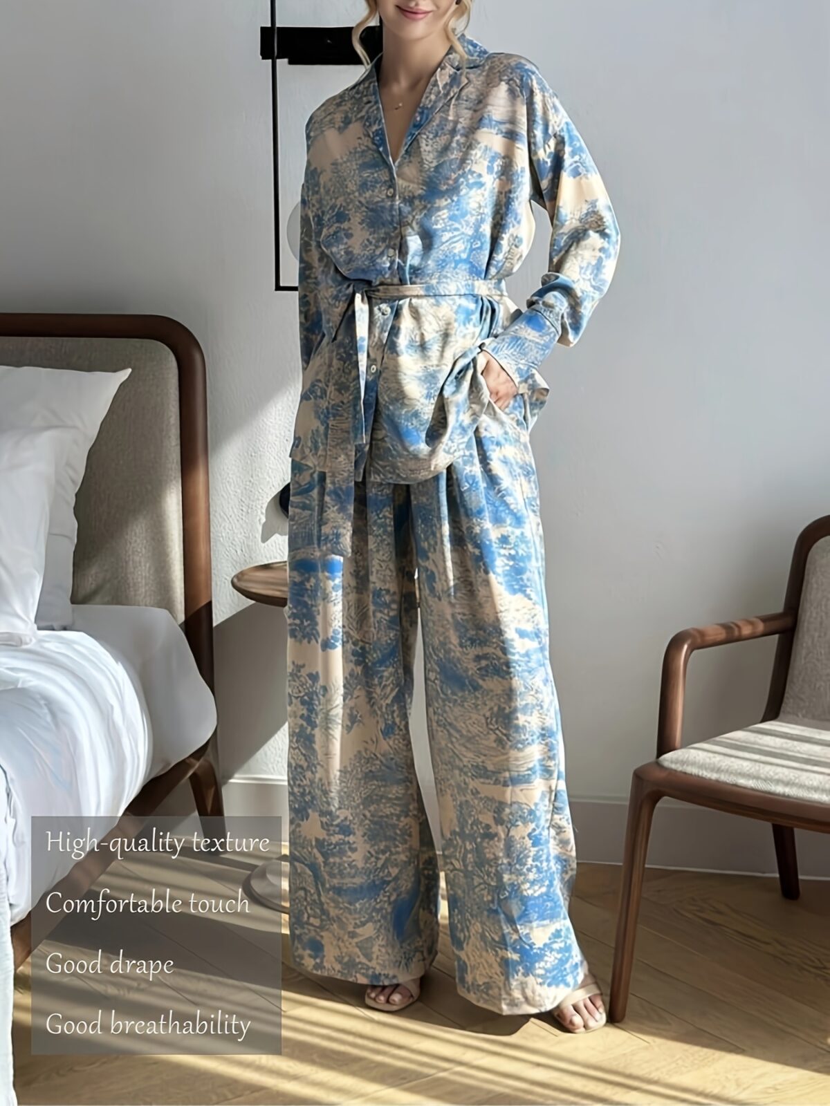 Effortlessly chic Riviera Romance floral print two piece set featuring a long sleeve shirt and wide leg pants perfect for all seasons