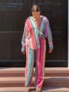 The Newness Riviera Striped Suit Set A chic spring outfit featuring a striped button up shirt and belted pants Perfect for any occasion