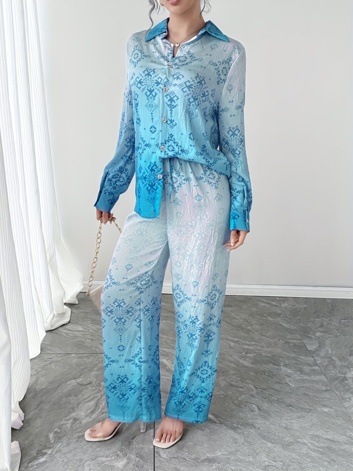 Stylish womens Dubai Nights Printed Pants Set from Newness Flattering wide leg pants and a coordinating top in a vibrant Middle Eastern inspired print Perfect for evening events or a chic daytime look