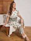 The Newness Riviera Rendezvous Geometric Print Set A stylish two piece outfit featuring a vibrant geometric print perfect for summer occasions Model showcases effortless chic