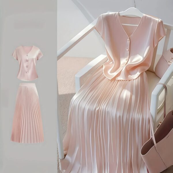 Flatlay of the Newness Bisous Rosé pink pleated midi set showcasing the skirt and top separately and together The set is a beautiful shade of pink and features delicate pleats