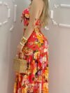 Model wearing the Newness Dubai Nights Tropical Print Suit a chic and effortless summer outfit perfect for a getaway The suit features a vibrant tropical print