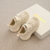 Stylish beige and white Active Ace Kids breathable casual sneakers with soft EVA sole and A branding perfect for boys and girls aged 14 and under