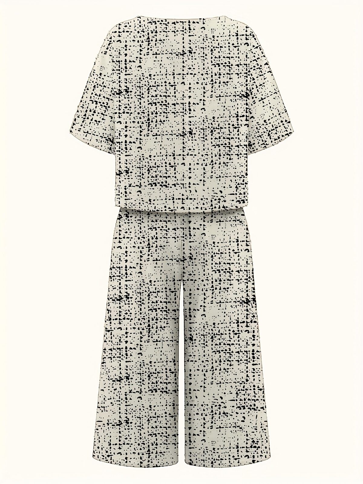 Model wearing the Newness Dubai Nights Geometric Print Set a two piece outfit with a striking geometric pattern