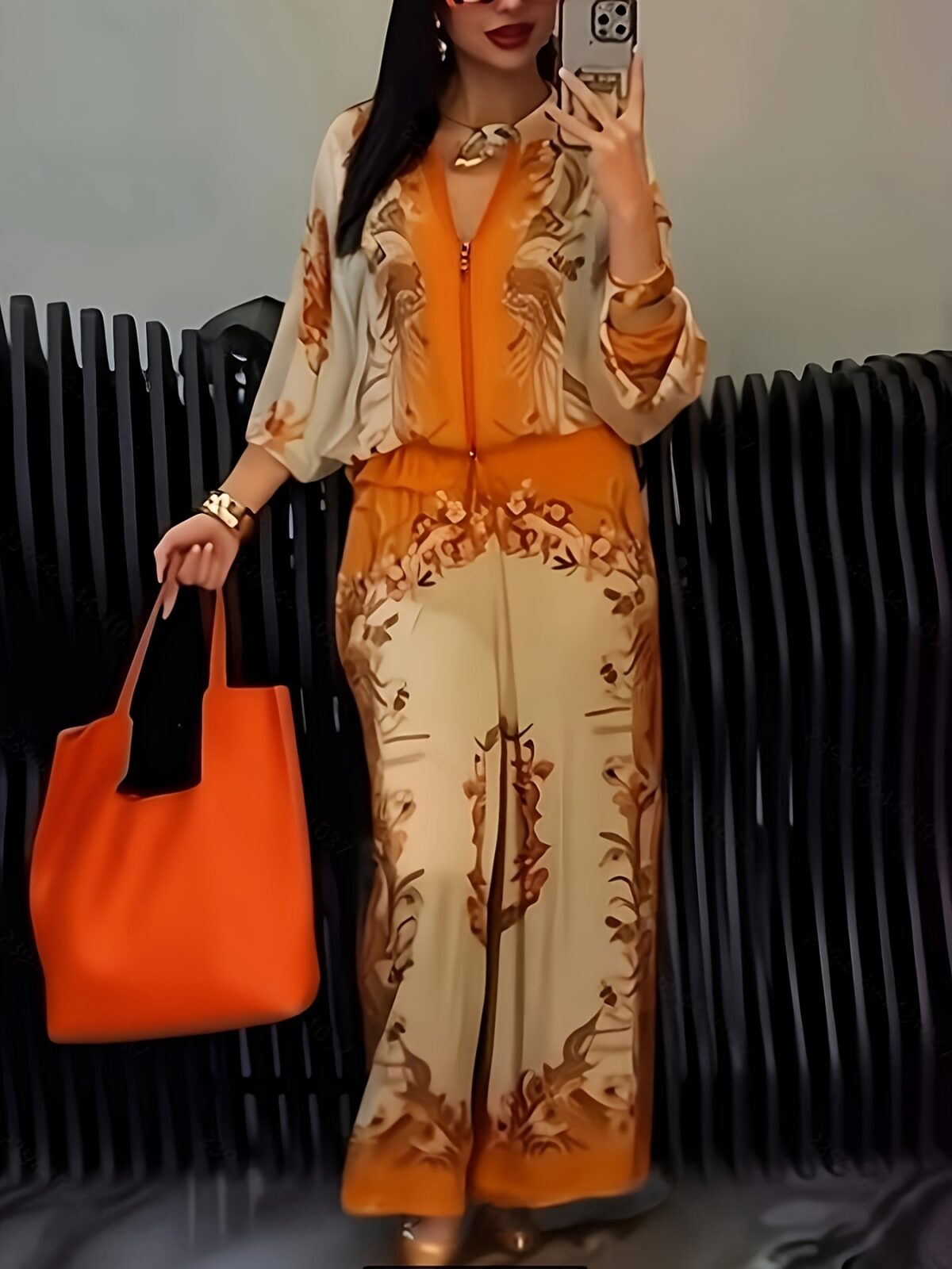 Model wearing the Newness Sunset Hues Ombre Print Two Piece Set showcasing the gradient colors and comfortable fit