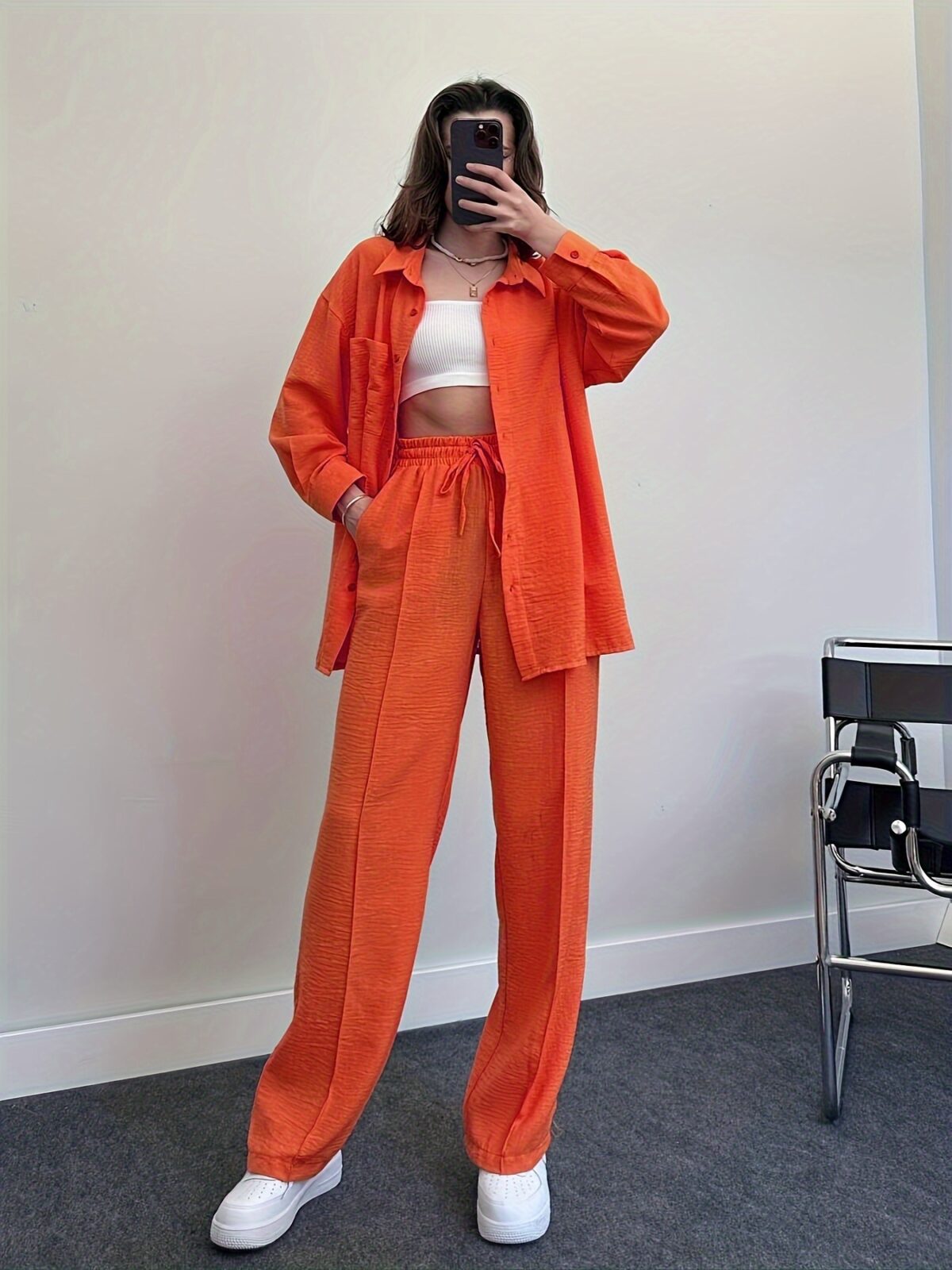 Model wearing a vibrant wide leg pants set perfect for spring The set features a flowy comfortable fit in a breathable polyester fabric