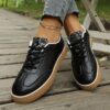Newness Urban Edge Retro Snake Sneakers Chic and comfortable sneakers with a retro snake print design perfect for any occasion