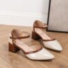 Newness Two Tone Pointed Toe Heels in brown These chic heels feature a chunky mid heel cut out design and brown cover straps Perfect for any occasion