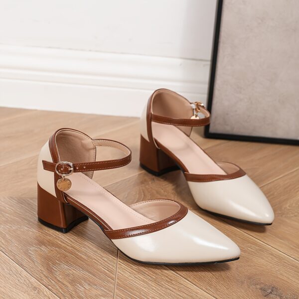 Newness Two Tone Pointed Toe Heels in brown These chic heels feature a chunky mid heel cut out design and brown cover straps Perfect for any occasion