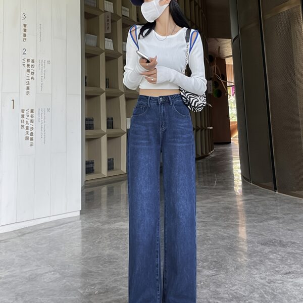 Flatlay of Newness Parisian High Waisted Wide Leg Jeans in a stylish setting The durable denim and flattering wide leg silhouette are highlighted