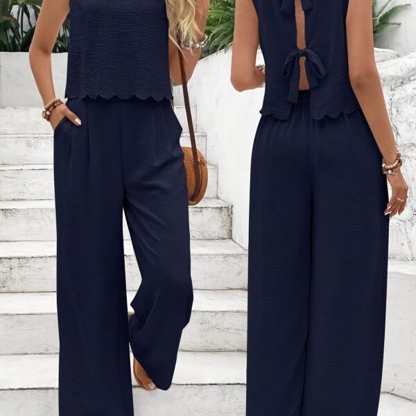 The Newness Riviera Navy Two Piece Set A stylish and comfortable navy blue two piece outfit perfect for spring and summer The image shows a model wearing the complete set