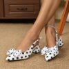 Classic black and white polka dot pumps from Newness perfect for adding a retro touch to any outfit