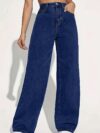 Model wearing Newness Dubai High Waisted Wide Leg Jeans a versatile pair of premium denim jeans in a flattering wide leg silhouette and high waisted fit perfect for any season