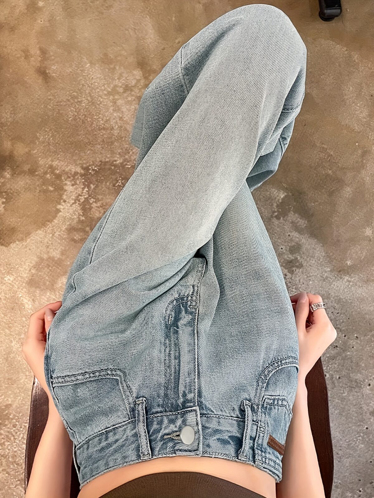 Model wearing Newness Dubai Nights High Waist Wide Leg Jeans showcasing the flattering high waist and wide leg silhouette The jeans are a versatile dark wash perfect for both day and night