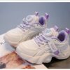 Pastel Petal Girls Sneakers with Rotating Buckle Closure   Trendy pastel pink and white sneakers with a unique rotating buckle perfect for school playdates and sports Breathable comfort and durable rubber sole