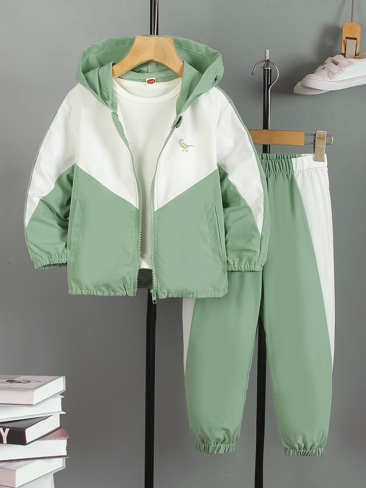 Stylish boys color block jacket and pants set featuring embroidered dinosaur details Perfect for spring or fall