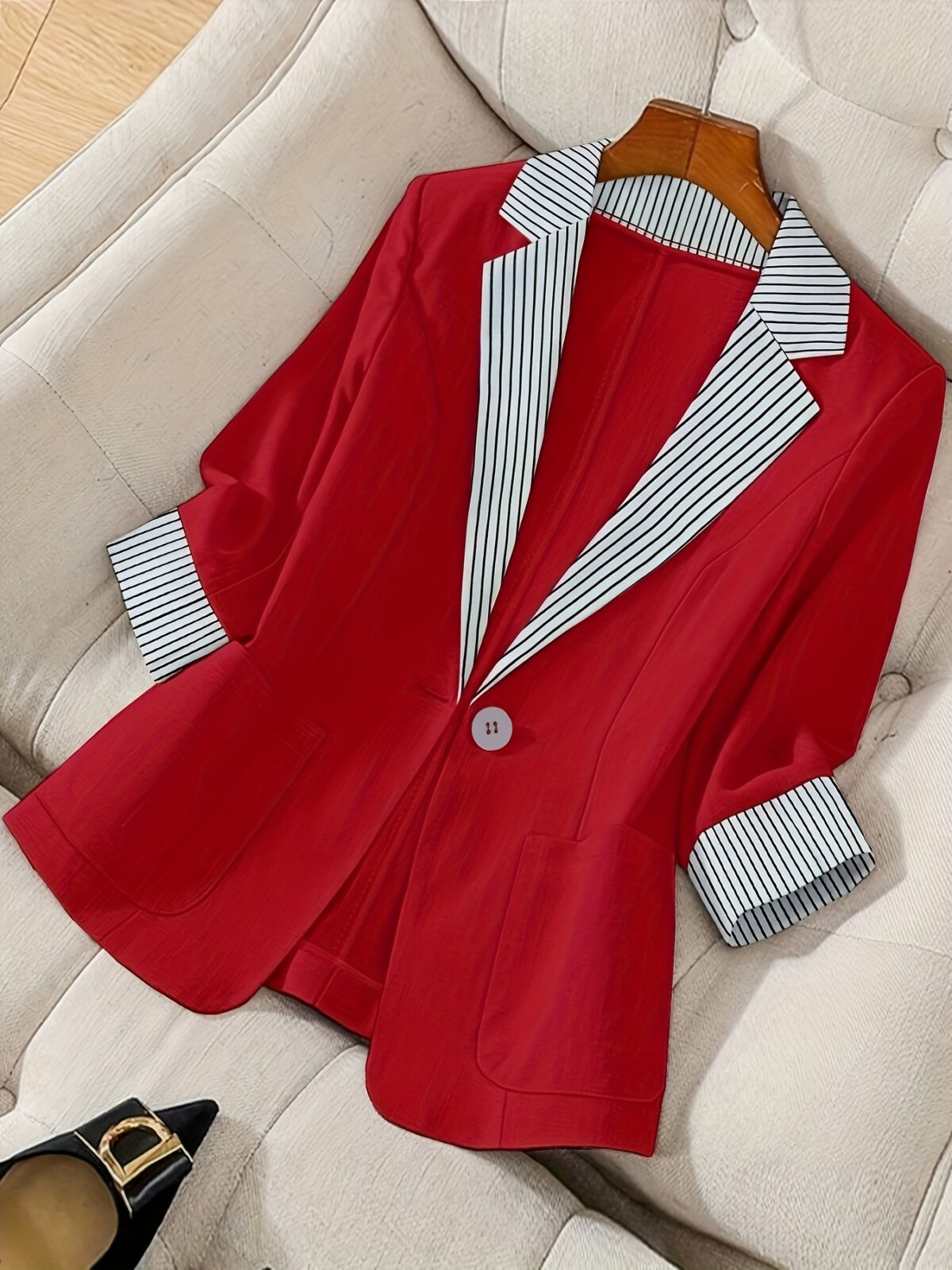 Stylish womens red and white striped blazer perfect for casual or office wear Features a single button closure and a flattering regular fit