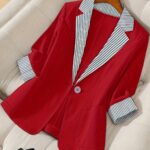 Stylish womens red and white striped blazer perfect for casual or office wear Features a single button closure and a flattering regular fit