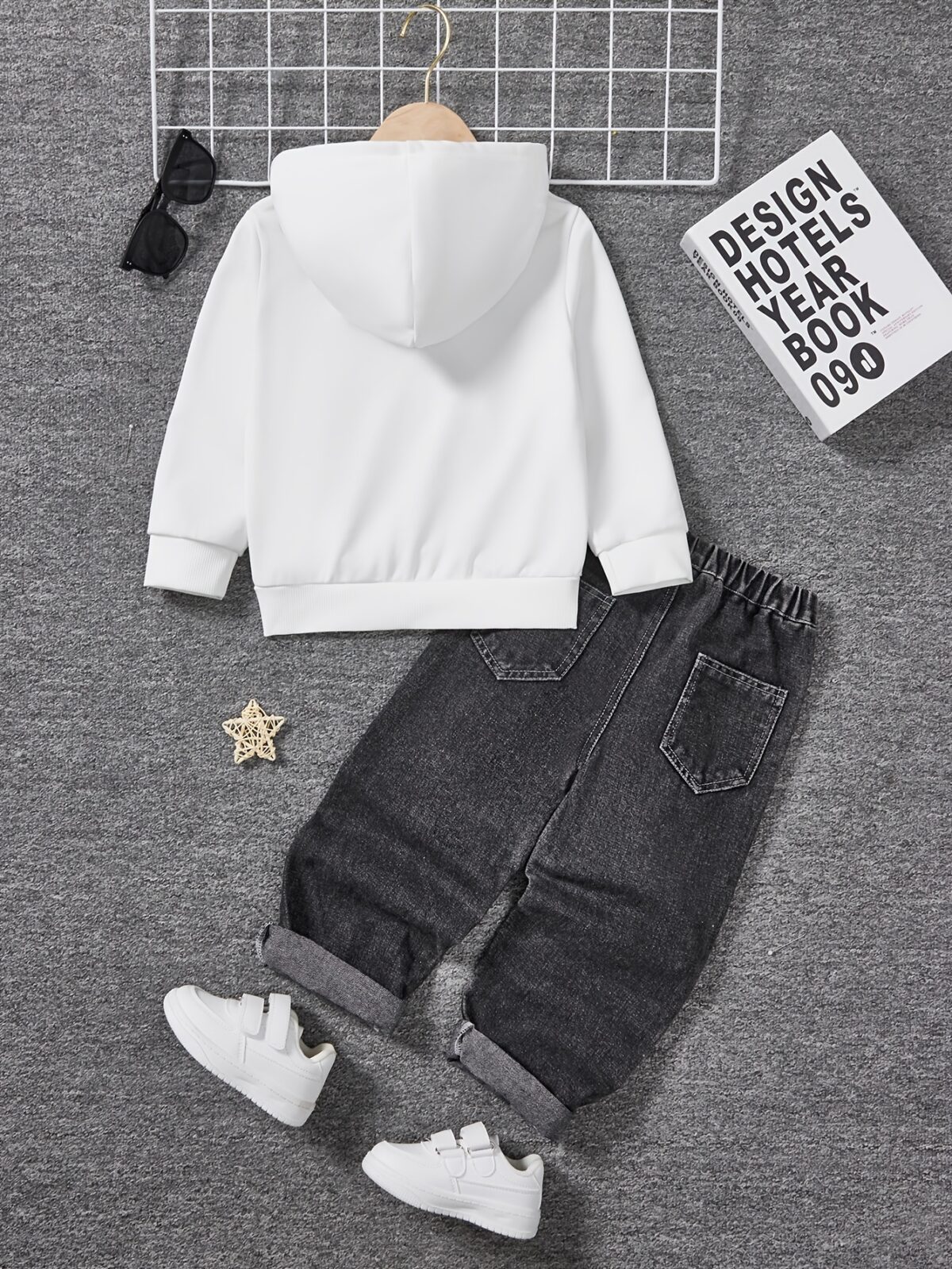Stylish boys fashion hoodie and pants set in trendy design perfect for outdoor play or casual wear The comfortable two piece outfit is shown on a child model