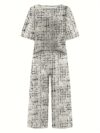 Model wearing the Newness Dubai Nights Geometric Print Set a two piece outfit with a striking geometric pattern