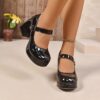 Newness Noir Radiance Mary Janes Glossy black Mary Jane shoes with chunky platform heels showcasing a chic and elevated style